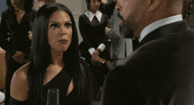 Woman In Black Dress Next To Man In Tuxedo GIF