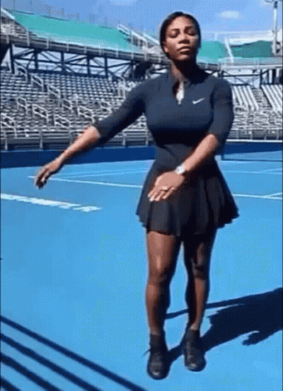 Woman In Black Dress On Blue Tennis Court GIF