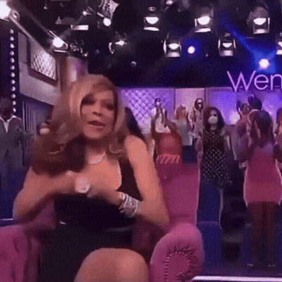 Woman In Black Dress On Pink Chair Saying Wen GIF