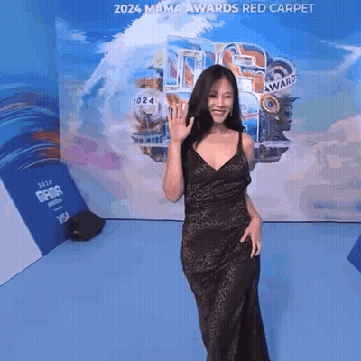 Woman In Black Dress On Red Carpet GIF