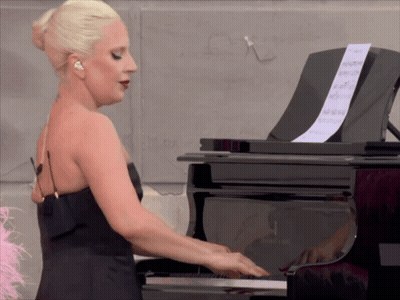 Woman In Black Dress Playing Piano GIF