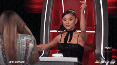 Woman In Black Dress Raising Arm NBC Logo GIF