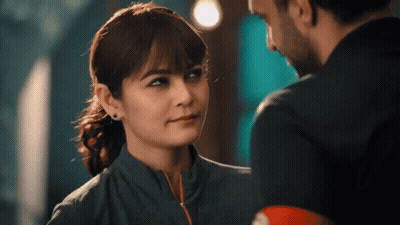 Woman In Black Dress Saying Do Tell GIF