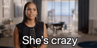 Woman In Black Dress Saying She's Crazy GIF