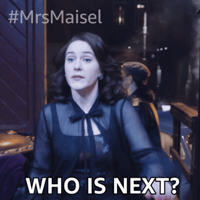 Woman In Black Dress Saying Who Is Next GIF