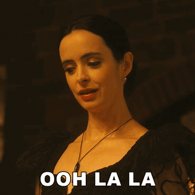 Woman In Black Dress Says Ooh Lala GIF