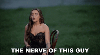 Woman In Black Dress Says The Nerve Of This Guy GIF