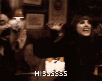 Woman In Black Dress Screaming Arms Outstretched Sign Hisssss GIF