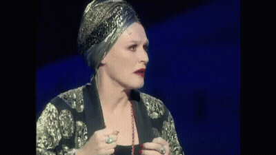 Woman In Black Dress Singing On Stage GIF