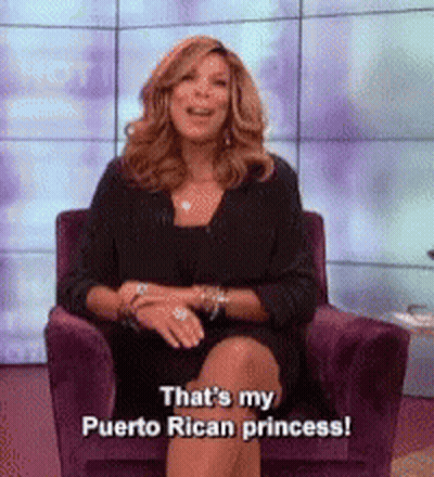 Woman In Black Dress Sitting In Purple Chair Saying That's My Puerto Rican Princess GIF