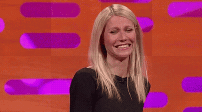 Woman In Black Dress Smiling And Laughing GIF