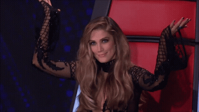 Woman In Black Dress Smiling In Red Chair GIF