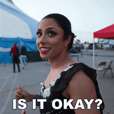 Woman In Black Dress Smiling Saying Is It Okay GIF