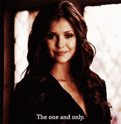 Woman In Black Dress Smiling Says The One And Only GIF