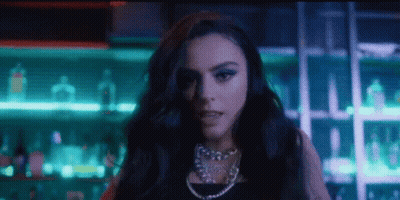 Woman In Black Dress Standing At Bar GIF