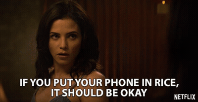Woman In Black Dress Standing Before Crowd GIF