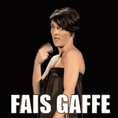 Woman In Black Dress Standing In Front Of Fais Gaffe Sign GIF
