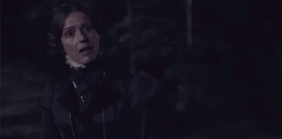 Woman In Black Dress Standing GIF