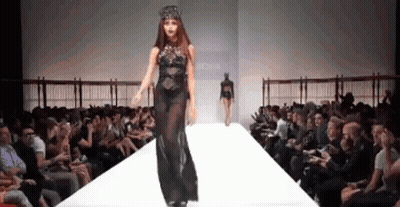 Woman In Black Dress Walking Runway GIF