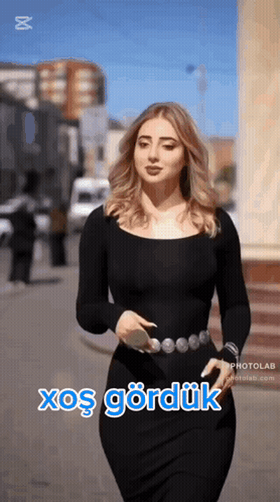 Woman In Black Dress Walking With Xoş Gördük GIF
