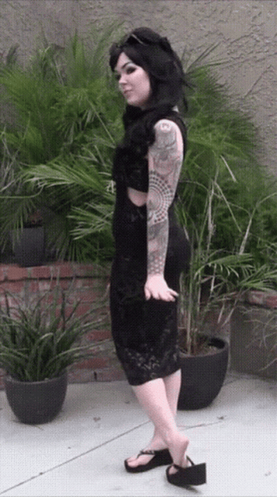 Woman In Black Dress With 'A' Tattoo GIF