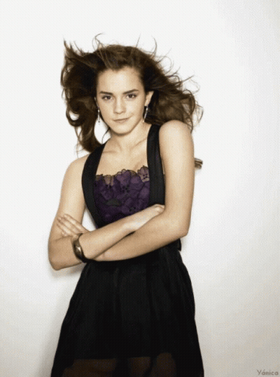 Woman In Black Dress With Arms Crossed GIF