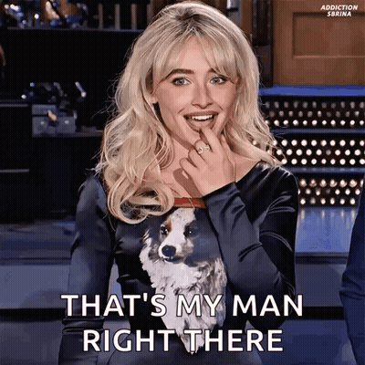 Woman In Black Dress With Dog Says That's My Man Right There GIF