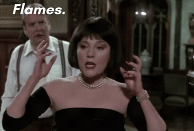 Woman In Black Dress With Flames GIF