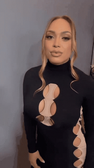 Woman In Black Dress With Holes GIF