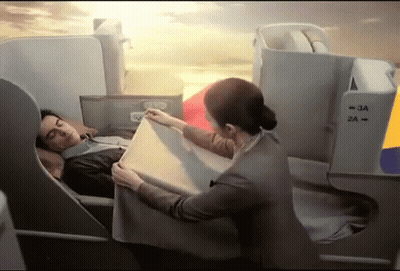 Woman In Black Dress With Necklace Saying Hey Handsome GIF