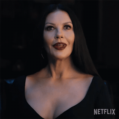 Woman In Black Dress With Netflix Logo GIF