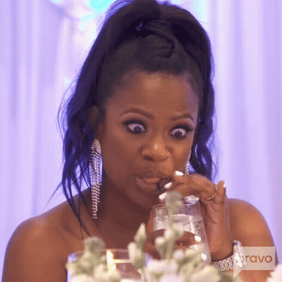 Woman In Black Dress With Rhinestone Sleeves GIF