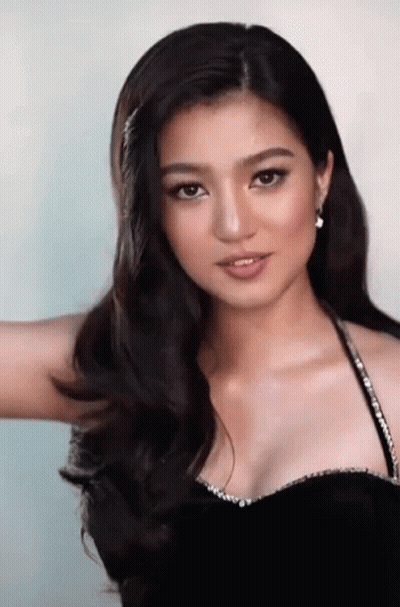 Woman In Black Dress With Rhinestone Straps GIF