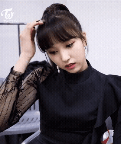 Woman In Black Dress With Twice TV Logo GIF