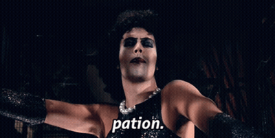 Woman In Black Dress With Word Pation On Chest GIF