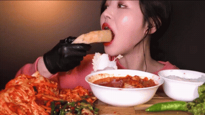 Woman In Black Gloves Eating GIF