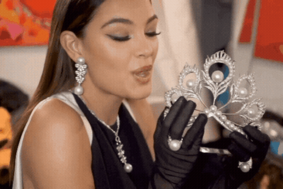 Woman In Black Gloves Holding Tiara GIF