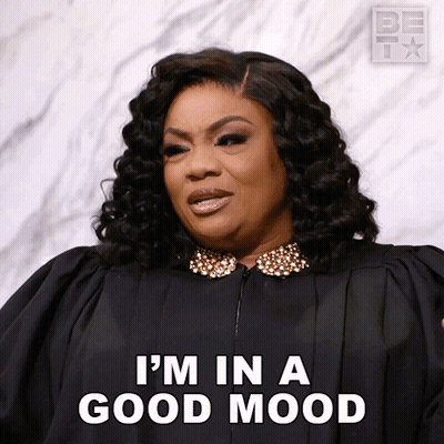 Woman In Black Gown Says I'm In A Good Mood GIF