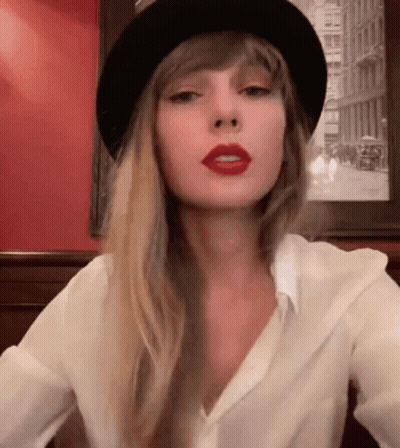 Woman In Black Hat And Red Lipstick GIF