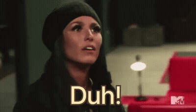 Woman In Black Hat And Scarf Saying Duh GIF