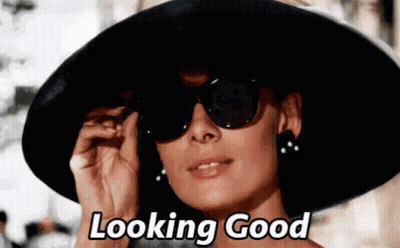 Woman In Black Hat And Sunglasses Says Looking Good GIF