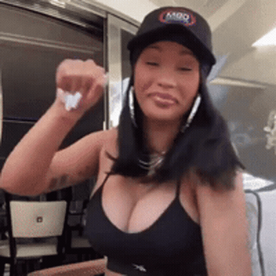 Woman In Black Hat And Tank Top GIF
