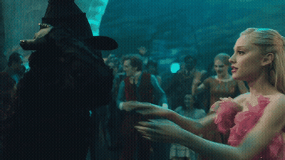Woman In Black Hat Hugging Another Woman GIF