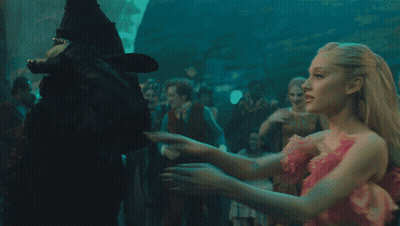 Woman In Black Hat Hugging Another Woman GIF