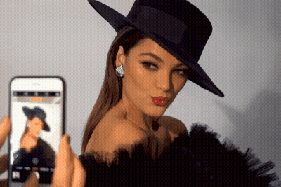 Woman In Black Hat Photographed By Phone GIF