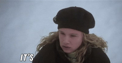 Woman In Black Hat Saying It's In White Letters GIF