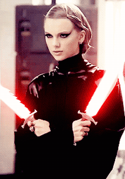 Woman In Black Holding Red Lightsabers GIF