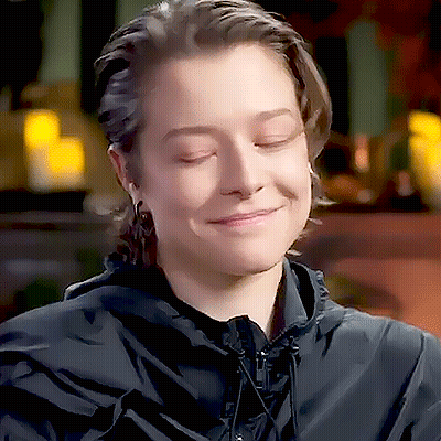 Woman In Black Hooded Jacket Smiling Eyes Closed GIF