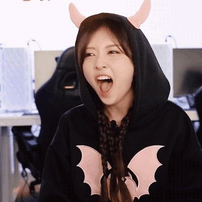 Woman In Black Hoodie With Bat GIF