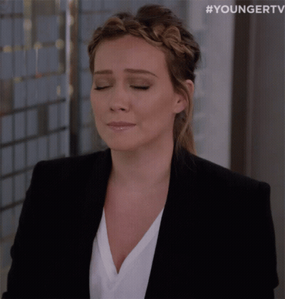 Woman In Black Jacket And Braided Headband Eyes Closed GIF